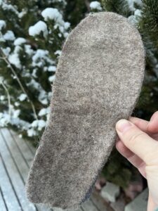 Alpaca insole. I have seen felt ones at the dollar store, they would also work.